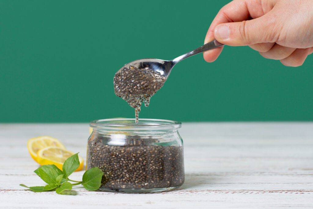 Close-up of chia seeds with antioxidant-rich fruits like blueberries