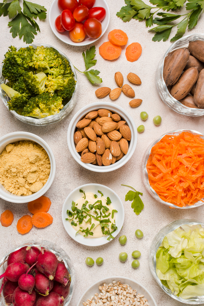 Assorted high-protein plant foods including lentils, tofu, and nuts on a kitchen counter